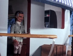 The Professor watches as Brains and Tin-Tin start to dive on the temple