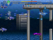 RVR-01 in underwater combat. The building in the background was borrowed from Air Buster/Aero Blasters, the bridge was ripped from Carrier Air Wing/U.S. Navy, and the mechanical squids were ripped from Darius Gaiden.