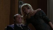 Napier being warned by Alicia what his boss, Carl Grissom will do if he learns of his affair with her.