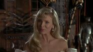 Vicki introducing herself to Bruce Wayne.