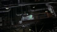 Batman using a smoke repellent to make his escape.