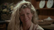 Vicki laughing at Bruce's joke of his dining room not being him.