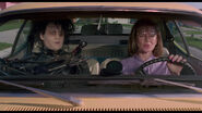 Peg accepting Edward's apology when he accidentally points his blades near her face.