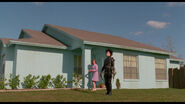 Peg escorting Edward inside.