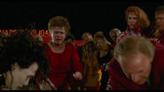 Peg and Bill stopping Edward as he tries to help Kevin.