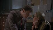 Vicki telling Knox she's interested in investigating the vigilante, Batman.