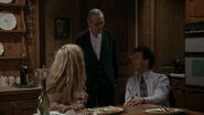 Bruce and Vicki bidding Alfred good night.