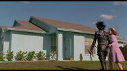 Peg and Edward arriving at her house.