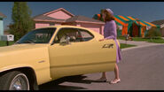 Peg getting into her car.