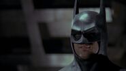 Batman giving Napier a taunting smirk before he disappears.