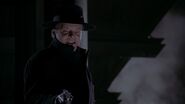 Napier about to shoot Gordon before he's stopped by Batman.