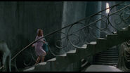 Peg climbing up a grand staircase.