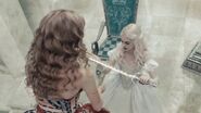 The Queen being given back the Vorpal Sword.