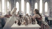 The Queen brewing a potion.