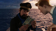 Captain Haddock and Tintin examining the brochure.