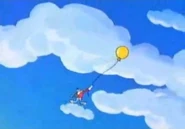 Buster takes to the skies on a balloon...