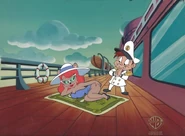 Julie and Monty in a music video for "Money (That's What I Want)"