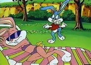 Babs in her swimsuit while Buster sneaks on her