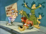 Pete Puma in a fire engine kiddie ride