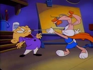 Babs as SuperBabs battles Wex Wuthor