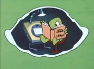 TyroneAcmeCatalog.png (246 KB) Tyrone looks inside an Acme catalog for something that will help him cross the highway