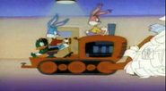 Buster, Babs, and Plucky drive a bulldozer to push their finished cartoon to the Camera Room...