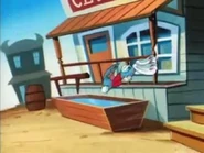 ...and tosses Buster in the water trough