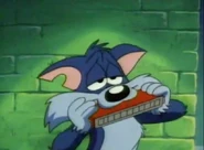 Furrball playing a harmonica