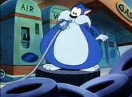 Furrball inflating himself at the gas station