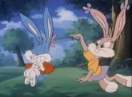 Babs tickles Buster with a flower