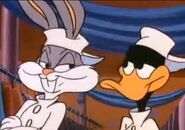 Bugs and Daffy at the end of the commercial for "Crazy Tazzie's House of Tuxes" in Prom-ise Her Anything