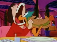 Roseanne about to eat Plucky in her sandwich