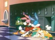 Plucky arrives in a gas mask to tell Buster about the Student of the Day contest