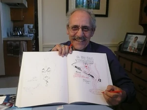 Art Leonardi holding an animation cell for The Pink Panther Show
