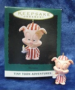 Hamton Pig in pajamas with a candle