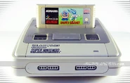 The Korean SNES along with the cartridge for Buster Busts Loose