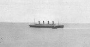 Last photograph of the Titanic above water.