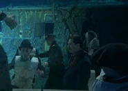 J. Bruce Ismay watch the loading of Collapsible C in Ghosts of The Abyss (2003)