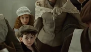 Irish Little Girl with her brother and mother waiting their turn to go up to the 