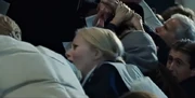 Lucy with the other passengers praying in the stern 