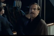 J. Bruce Ismay helping the passengers to get into Collapsible C in Titanic (1997)