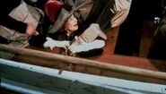Margaret Brown being forced to board Lifeboat 6 in S.O.S. Titanic