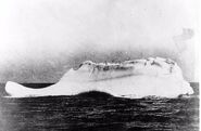 This is a photograph of an iceberg with which the RMS Titanic may have collided on April 14, 1912. This print was in possession of Captain De Carteret, the Captain of the CS Minia, who reportedly stated that this was the only iceberg near the scene of the collision. Other accounts indicated that there were several icebergs in the area. The Minia was one of the first ships to reach the scene following the disaster, arriving on April 26. It was dispatched after the Western Union CS Mackay-Bennett by White Star Lines to recover debris from Titanic. During this operation, the Minia found debris and bodies floating in the vicinity of the above iceberg. Captain De Carteret gave the print to Captain A. L. Gamble, Commanding Officer of the USCGC Seneca.]]