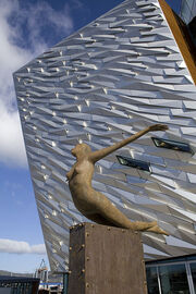 Rowan Gillespie's sculpture Titanica in front of Titanic Belfast