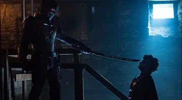 Deathstroke_pointing_his_sword_at_Jason