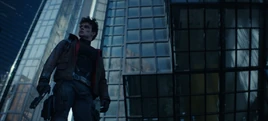 Jason Todd walking in Gotham City