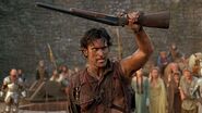 Ash Williams (Bruce Campbell) holding the Stoeger in the Army of Darkness