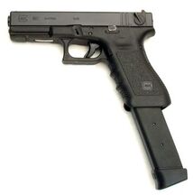 The Glock 18 in real life, with a 33-round extended magazine