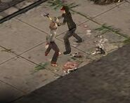 A survivor sending a zombie back to its grave with the shovel