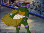 Donatello using jetski to pursue Professor Cycloid in Donatello Makes Time
